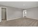 Bedroom with carpet, walk-in closet, modern light grey color scheme, and connected bathroom at 1704 Beach St, Greenwood, IN 46143