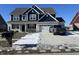 Inviting two-story house with a two-car garage and attractive curb appeal, enhanced by a truck parked on the driveway at 1704 Beach St, Greenwood, IN 46143