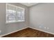 A room with hardwood floors and a view through the window at 1704 Beach St, Greenwood, IN 46143