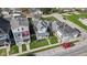 Aerial view of a charming two-story home with well-kept landscaping and adjacent colorful houses at 1724 Prospect St, Indianapolis, IN 46203