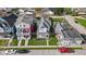 Aerial shot of a neighborhood showcasing a charming home with a welcoming front porch and well-kept lawns at 1724 Prospect St, Indianapolis, IN 46203