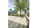 An outdoor deck with wood railings overlooking the lawn and backyard at 1724 Prospect St, Indianapolis, IN 46203