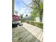 An outdoor deck with patio furniture overlooking the lawn and backyard at 1724 Prospect St, Indianapolis, IN 46203