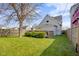 This backyard has a nice deck, green lawn and a well manicured shrubbery area at 1724 Prospect St, Indianapolis, IN 46203