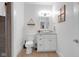 Bright bathroom with a vanity, decorative mirror, and elegant wall decor, providing a clean and stylish space at 1724 Prospect St, Indianapolis, IN 46203
