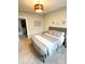 Serene bedroom featuring soft grey tones and a view into an adjacent room at 1724 Prospect St, Indianapolis, IN 46203