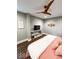 Comfortable bedroom featuring a modern ceiling fan, stylish decor, and sleek furniture at 1724 Prospect St, Indianapolis, IN 46203