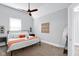 Cozy bedroom with a ceiling fan, a comfortable bed, and stylish decor, creating a relaxing atmosphere at 1724 Prospect St, Indianapolis, IN 46203