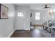 Bright entryway featuring a white door, artwork, and seamless flow into the living area with stairs at 1724 Prospect St, Indianapolis, IN 46203