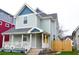 Charming two-story home with a welcoming front porch and nicely landscaped yard at 1724 Prospect St, Indianapolis, IN 46203