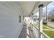 Covered front porch with white pillars and railings offering a comfortable outdoor space with street view at 1724 Prospect St, Indianapolis, IN 46203