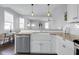 Spacious kitchen with modern appliances, a farmhouse sink, breakfast bar, and neutral color palette at 1724 Prospect St, Indianapolis, IN 46203