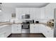 Charming kitchen with white cabinets, granite countertops, and stainless steel appliances for cooking at 1724 Prospect St, Indianapolis, IN 46203