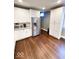 Modern kitchen featuring stainless steel appliances, white cabinets, and hardwood floors at 1724 Prospect St, Indianapolis, IN 46203