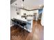 Modern kitchen featuring stainless steel appliances, white cabinets, and a stylish breakfast bar at 1724 Prospect St, Indianapolis, IN 46203