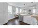 Open kitchen featuring a breakfast bar, stainless steel dishwasher, and a cozy dining area at 1724 Prospect St, Indianapolis, IN 46203