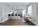 Open concept kitchen with a breakfast bar, stainless steel appliances, and an adjacent dining area at 1724 Prospect St, Indianapolis, IN 46203