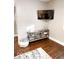 Cozy corner with a modern TV stand, mounted TV, and ample space for relaxation at 1724 Prospect St, Indianapolis, IN 46203