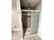 Modern shower featuring a glass door, tiled walls, and a sleek showerhead at 1724 Prospect St, Indianapolis, IN 46203