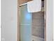 Modern shower with tiled walls and a frosted glass door, creating a sleek and private space at 1724 Prospect St, Indianapolis, IN 46203