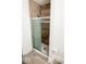Modern bathroom featuring a shower with tile surround and sliding glass door at 1724 Prospect St, Indianapolis, IN 46203