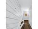 Open staircase with brown carpet runner and white painted walls and rails at 1724 Prospect St, Indianapolis, IN 46203