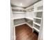 Spacious walk-in closet with built-in shelving and hanging rods for optimal storage at 1724 Prospect St, Indianapolis, IN 46203