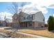 Charming two-story home with a brick and siding exterior, a well-manicured lawn, and an attached two-car garage at 1841 Sonesta Ln, Indianapolis, IN 46217