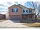Inviting two-story home with brick and siding, attached garage, and a well-kept lawn at 1841 Sonesta Ln, Indianapolis, IN 46217