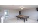 Large game room with billiard table, ceiling fan, and neutral colored carpet at 1841 Sonesta Ln, Indianapolis, IN 46217