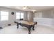 Spacious game room with pool table, ceiling fan, and access to other living spaces at 1841 Sonesta Ln, Indianapolis, IN 46217