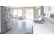 Open-concept kitchen and dining area with stainless steel appliances and bright natural light at 1841 Sonesta Ln, Indianapolis, IN 46217