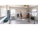 Bright living room with wood floors, large windows, and musical instruments creating an inspiring space at 1841 Sonesta Ln, Indianapolis, IN 46217
