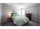 Bright bedroom with a comfortable bed, wooden nightstand, and decor at 19149 Gillcrest Dr, Noblesville, IN 46062