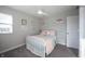 Bright bedroom with fun wall art, and ceiling fan at 19149 Gillcrest Dr, Noblesville, IN 46062