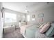 Decorated bedroom with colorful art, plush pillows, and ceiling fan at 19149 Gillcrest Dr, Noblesville, IN 46062