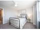 Comfortable bedroom showcasing neutral walls, gray carpet, and a black metal bedframe at 19149 Gillcrest Dr, Noblesville, IN 46062