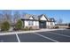 Community clubhouse featuring a brick and siding exterior with ample parking at 19149 Gillcrest Dr, Noblesville, IN 46062