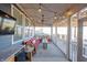 Relaxing covered patio with outdoor seating, string lights, and ceiling fan at 19149 Gillcrest Dr, Noblesville, IN 46062