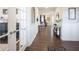 Elegant foyer leads to the living area, showcasing wainscoting and dark wood floors at 19149 Gillcrest Dr, Noblesville, IN 46062