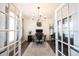 Stylish home office featuring shiplap walls, a grand piano, and modern decor at 19149 Gillcrest Dr, Noblesville, IN 46062
