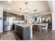 Open-concept kitchen with a large island that flows into the dining and living spaces at 19149 Gillcrest Dr, Noblesville, IN 46062