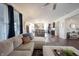 Bright living room featuring an L-shaped couch, a fireplace, hardwood floors, and lots of natural light at 19149 Gillcrest Dr, Noblesville, IN 46062