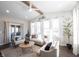 Bright living room with neutral tones, stylish decor, and a sliding glass door for outdoor access at 19149 Gillcrest Dr, Noblesville, IN 46062
