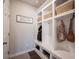 Well-organized mudroom with built-in storage, hooks, and baskets, perfect for entryway organization at 19149 Gillcrest Dr, Noblesville, IN 46062