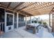Inviting outdoor dining area beneath a charming pergola, complete with string lights at 19149 Gillcrest Dr, Noblesville, IN 46062