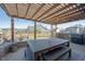 Enjoy al fresco dining under the wood pergola in this beautiful backyard at 19149 Gillcrest Dr, Noblesville, IN 46062