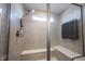 Glass-enclosed shower with dual shower heads and bench seating at 19149 Gillcrest Dr, Noblesville, IN 46062