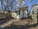 Backyard featuring a detached garage and wood fence at 1929 Wilcox St, Indianapolis, IN 46222