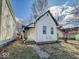 A cozy home with a small yard and a traditional design on a sunny day at 1929 Wilcox St, Indianapolis, IN 46222
